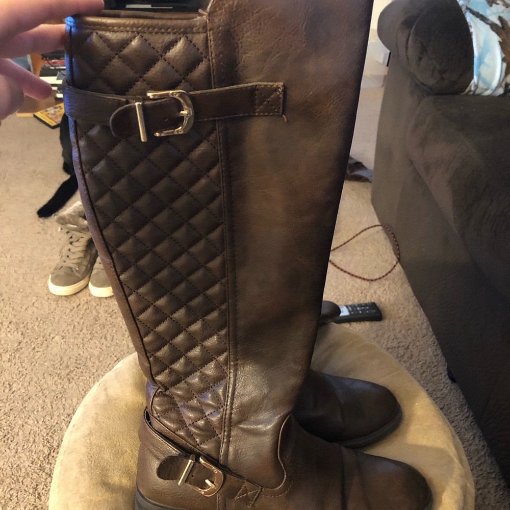 Brown knee high boots.